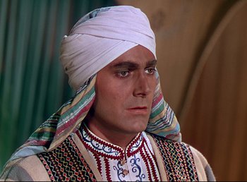 Movie still from “Arabian Nights” (1942), directed by John Rawlins – A person wearing a turban; Close Up shot, High angle
