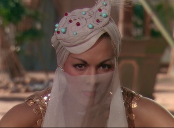 Movie still from “Arabian Nights” (1942), directed by John Rawlins – A woman with a turban on her head; Close Up shot, High angle
