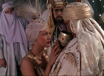 Movie still from “Arabian Nights” (1942), directed by John Rawlins – A man and a woman dressed in egyptian costumes; Medium shot, Over the shoulder angle