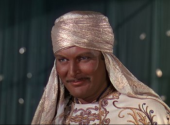Movie still from “Arabian Nights” (1942), directed by John Rawlins – A man with a gold turban on his head; Close Up shot, High angle