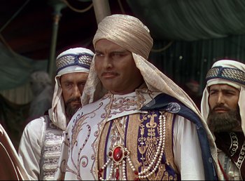 Movie still from “Arabian Nights” (1942), directed by John Rawlins – A group of men standing next to each other; Close Up shot, Low angle