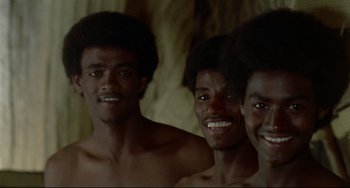 Movie still from “Arabian Nights” (1974), directed by Pier Paolo Pasolini – A group of young men standing next to each other; Close Up shot, Low angle