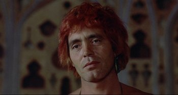 Movie still from “Arabian Nights” (1974), directed by Pier Paolo Pasolini – A person with red hair; Close Up shot, Low angle