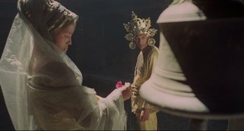 Movie still from “Arabian Nights” (1974), directed by Pier Paolo Pasolini – A man and a woman dressed in costumes; Medium shot, Low angle