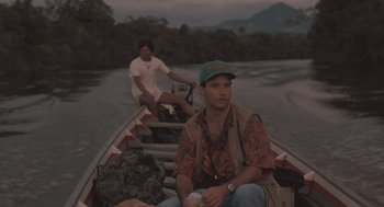 Movie still from “Arachnophobia” (1990), directed by Frank Marshall – Two men are sitting in a boat on the water; Medium shot, Low angle