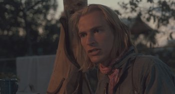 Movie still from “Arachnophobia” (1990), directed by Frank Marshall – A person wearing a jacket; Close Up shot, Over the shoulder angle