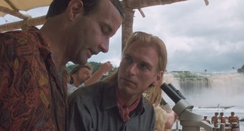 Movie still from “Arachnophobia” (1990), directed by Frank Marshall – Two men are looking at something in a microscope; Close Up shot, Over the shoulder angle