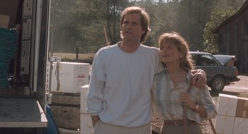 Movie still from “Arachnophobia” (1990), directed by Frank Marshall – A man and a woman standing next to each other; Medium shot, Low angle