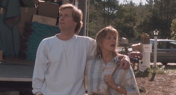 Movie still from “Arachnophobia” (1990), directed by Frank Marshall – A man and a woman standing next to each other; Medium shot, Low angle