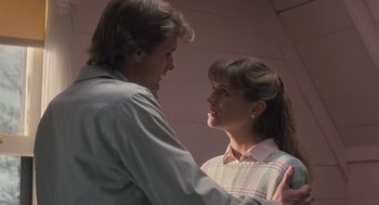 Movie still from “Arachnophobia” (1990), directed by Frank Marshall – A man and a woman standing next to each other; Medium shot, Low angle