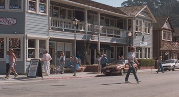 Movie still from “Arachnophobia” (1990), directed by Frank Marshall – A group of people walking down a street; Wide shot, High angle