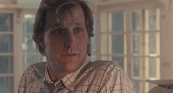 Movie still from “Arachnophobia” (1990), directed by Frank Marshall – A person wearing a plaid shirt; Close Up shot, Low angle