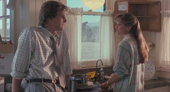 Movie still from “Arachnophobia” (1990), directed by Frank Marshall – A man and a woman standing in front of a sink; Medium shot, Low angle