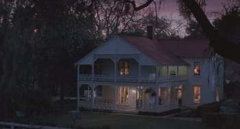 Movie still from “Arachnophobia” (1990), directed by Frank Marshall – A large white house sitting in the middle of a field; Extreme Wide shot, High angle