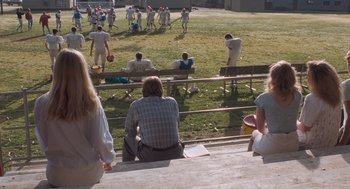 Movie still from “Arachnophobia” (1990), directed by Frank Marshall – A group of people sitting on top of bleachers; Wide shot, High angle