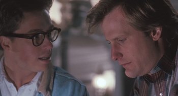 Movie still from “Arachnophobia” (1990), directed by Frank Marshall – A man and a woman are talking to each other; Close Up shot, Over the shoulder angle