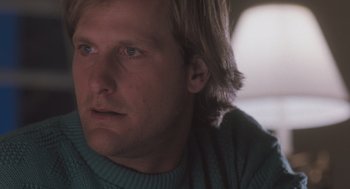 Movie still from “Arachnophobia” (1990), directed by Frank Marshall – A person wearing a sweater; Close Up shot, Low angle