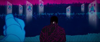 Movie still from “Archenemy” (2020), directed by Adam Egypt Mortimer – A man in a black jacket standing in front of an audience; Wide shot, Low angle