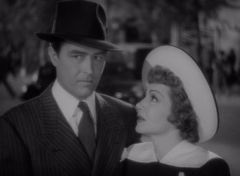 Movie still from “Arise, My Love” (1940), directed by Mitchell Leisen – A man and a woman standing next to each other; Close Up shot, Low angle