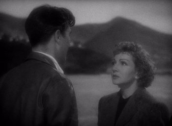 Movie still from “Arise, My Love” (1940), directed by Mitchell Leisen – A man and a woman talking to each other; Medium shot, High angle
