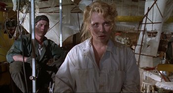 Movie still from “Arizona Dream” (1993), directed by Emir Kusturica – A man and a woman standing next to each other; Medium shot, Low angle