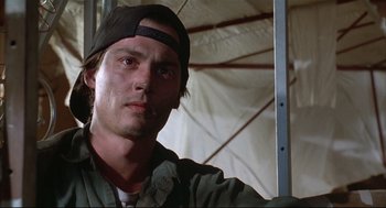 Movie still from “Arizona Dream” (1993), directed by Emir Kusturica – A person wearing a hat; Close Up shot, Low angle