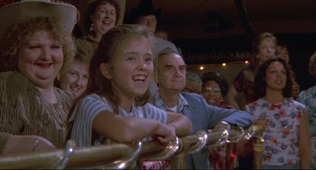 Movie still from “Arizona Dream” (1993), directed by Emir Kusturica – A group of people standing next to a railing; Close Up shot, Over the shoulder angle