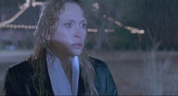 Movie still from “Arizona Dream” (1993), directed by Emir Kusturica – A woman with wet hair and a white shirt; Close Up shot, High angle