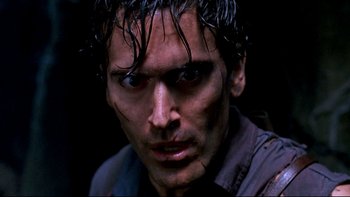 Movie still from “Army of Darkness” (1992), directed by Sam Raimi – A person with wet hair; Close Up shot, Low angle