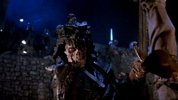 Movie still from “Army of Darkness” (1992), directed by Sam Raimi – A creature in a dark setting; Close Up shot, Low angle