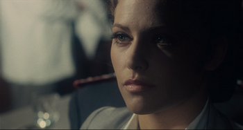 Movie still from “Army of Shadows” (1969), directed by Jean-Pierre Melville – A woman's face in the dark; Close Up shot, Over the shoulder angle