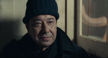 Movie still from “Army of Shadows” (1969), directed by Jean-Pierre Melville – A person wearing a hat; Close Up shot, Low angle