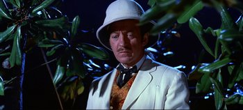 Movie still from “Around the World in 80 Days” (1956), directed by John Farrow – A man in a white suit and a white hat; Close Up shot, High angle