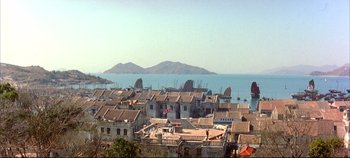 Movie still from “Around the World in 80 Days” (1956), directed by John Farrow – A view of a city with a view of the ocean; Extreme Wide shot, High angle