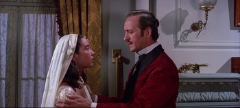 Movie still from “Around the World in 80 Days” (1956), directed by John Farrow – A man and a woman are standing in front of each other; Medium shot, Over the shoulder angle