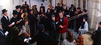Movie still from “Around the World in 80 Days” (1956), directed by John Farrow – A group of people standing around a crowd of people; Wide shot, High angle