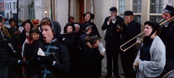 Movie still from “Around the World in 80 Days” (1956), directed by John Farrow – A group of people standing next to each other on a street; Medium shot, Low angle
