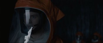 Movie still from “Arrival” (2016), directed by Denis Villeneuve – A man is looking into a mirror in the dark; Close Up shot, Low angle