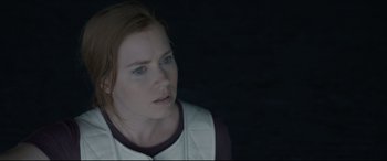 Movie still from “Arrival” (2016), directed by Denis Villeneuve – A person looking at the camera; Close Up shot, Over the shoulder angle