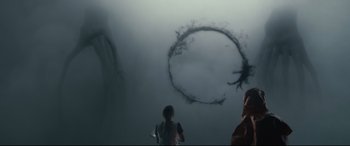 Movie still from “Arrival” (2016), directed by Denis Villeneuve – Two people are looking at an object in the sky; Extreme Wide shot, Over the shoulder angle