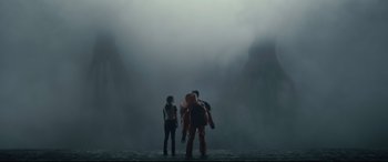 Movie still from “Arrival” (2016), directed by Denis Villeneuve – A group of people standing in the middle of a foggy area; Extreme Wide shot, Low angle