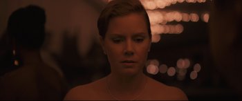 Movie still from “Arrival” (2016), directed by Denis Villeneuve – A person with short hair; Close Up shot, Over the shoulder angle
