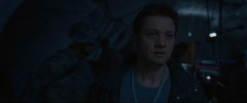 Movie still from “Arrival” (2016), directed by Denis Villeneuve – Jeremy renner's face in a dark room; Close Up shot, Low angle