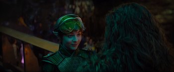 Movie still from “Artemis Fowl” (2020), directed by Kenneth Branagh – A woman in a green suit and goggles; Close Up shot, Over the shoulder angle