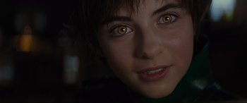Movie still from “Artemis Fowl” (2020), directed by Kenneth Branagh – A person's face with yellow eyes; Extreme Close Up shot, High angle