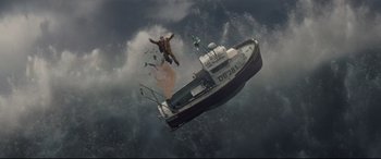 Movie still from “Artemis Fowl” (2020), directed by Kenneth Branagh – A man falling off a boat in the ocean; Extreme Wide shot, Overhead angle