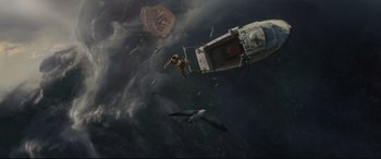 Movie still from “Artemis Fowl” (2020), directed by Kenneth Branagh – A bird flying over a boat in the ocean; Extreme Wide shot, Overhead angle