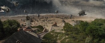 Movie still from “Artemis Fowl” (2020), directed by Kenneth Branagh – An aerial view of an area with a lot of buildings and people; Extreme Wide shot, Overhead angle