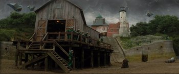 Movie still from “Artemis Fowl” (2020), directed by Kenneth Branagh – A group of people standing on top of a wooden structure; Extreme Wide shot, Low angle