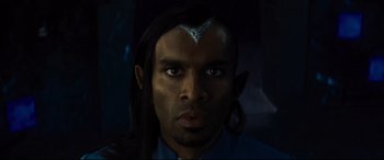 Movie still from “Artemis Fowl” (2020), directed by Kenneth Branagh – A person wearing a costume; Close Up shot, Overhead angle